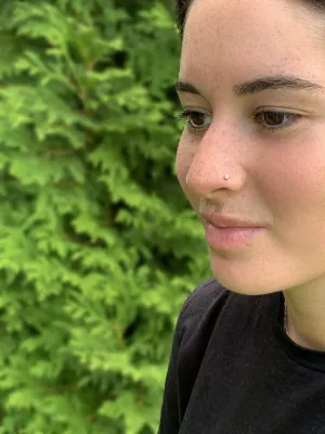 Lavari Jewelers 22 Gauge Curved Screw Nose Stud for Women or Men - 14k White Gold Nose Ring - 2mm Cubic Zirconia Bezel Setting Stud - Unisex Hypoallergenic Nostril Piercing Jewelry - 22G Body Piercing